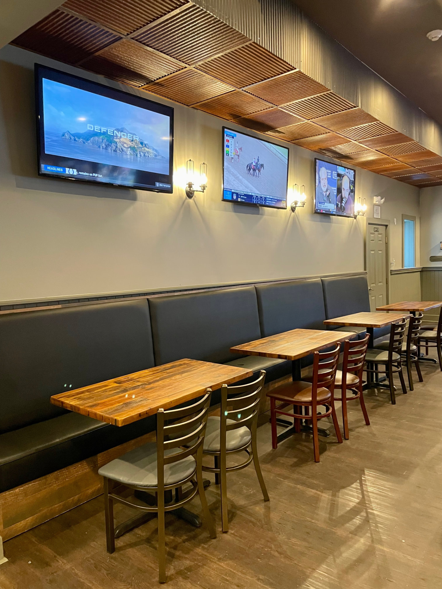 Tables and sports screens at The Chapter House